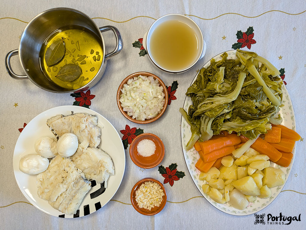 A festive table for Roupa Velha: cooked cod, eggs, potatoes, carrots, greens, olive oil with bay leaf, chopped onion, minced garlic, salt, and beef broth. Perfect for your Christmas recipe.