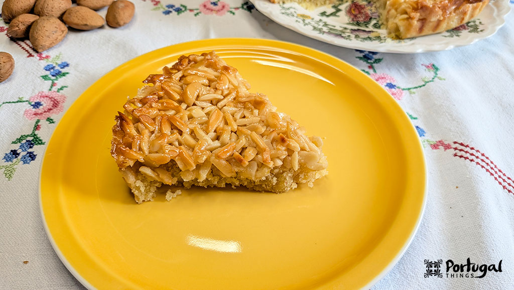 slice of almond tart on a yellow plate