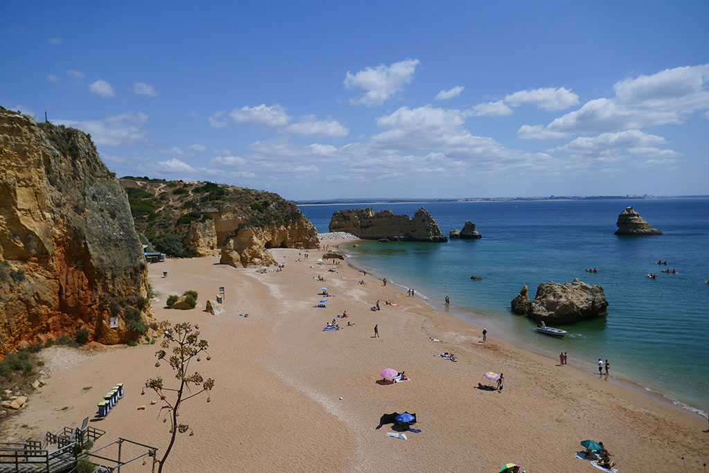Typical Algarve beach with golden sand and turquoise sea.