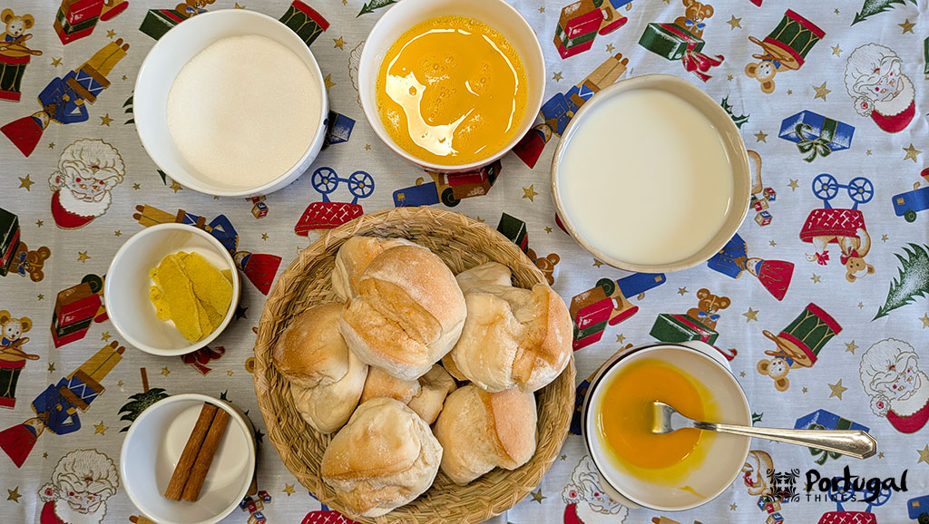 Rabanadas Poveiras – Traditional Portuguese Recipe from Póvoa de Varzim 3 A table with various ingredients needed to make Rabanadas Poveiras: eggs, bread, milk, sugar, cinnamon, and lemon peel