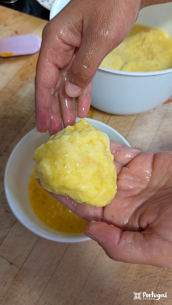 Rabanadas Poveiras – Traditional Portuguese Recipe from Póvoa de Varzim 9 a hand passes bread through eggs